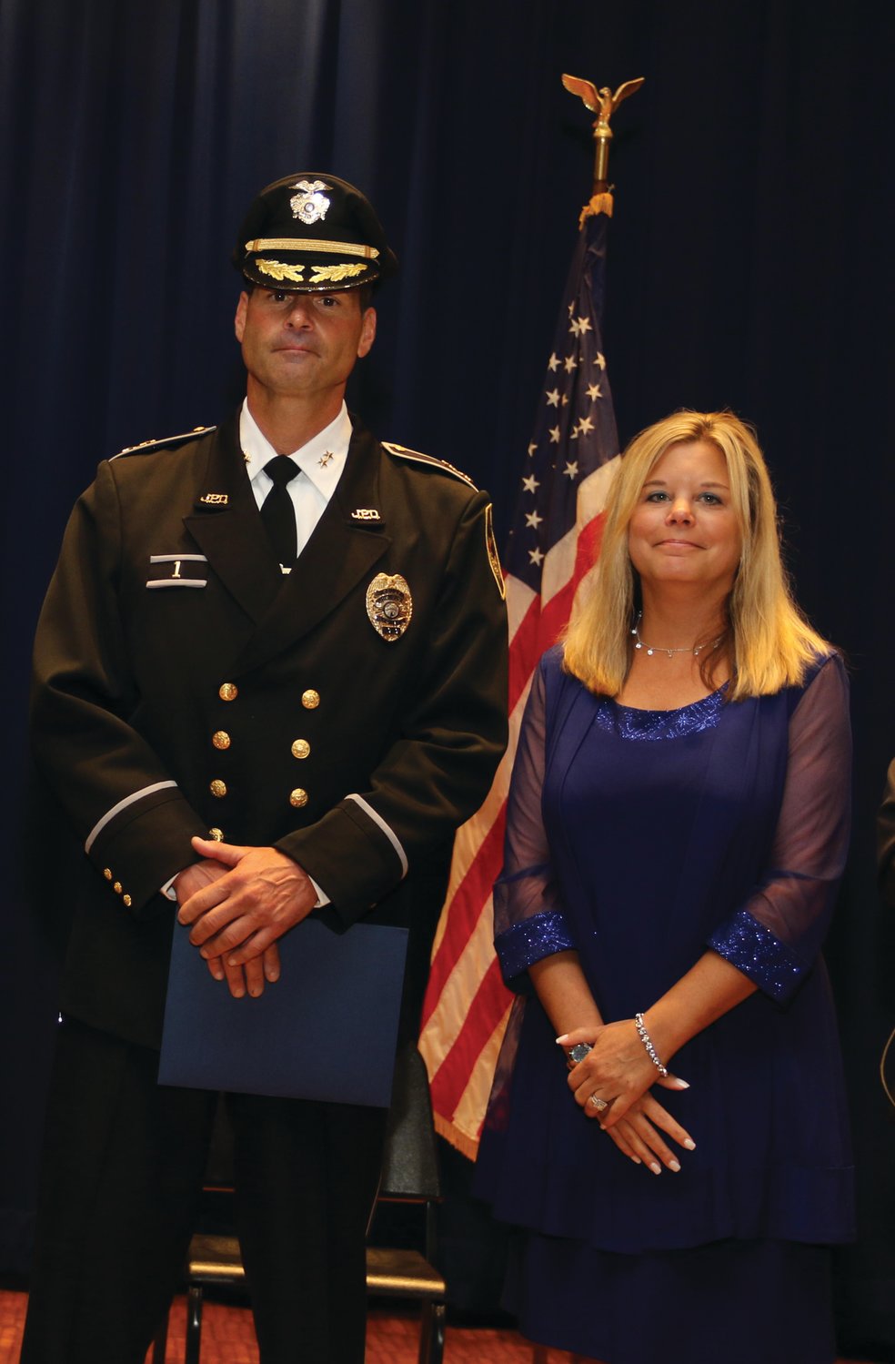 SWORN IN: On Aug. 31, 2020, former Johnston Mayor Joseph Polisena swore Razza in as the department’s eighth chief, while his wife Mandi pinned on his badge. He posed for a photo with his wife after the ceremony.